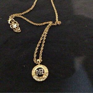 Nina Ricci Signed Gold Plated Necklace with Gold/Silver Logo Pendant/Crystals.